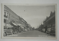 RPPC C1930 MAIN STREET STAUNTON ILLINOIS DAIRY TRUCK REXALL DRUGS AUTOS POSTCARD picture