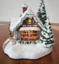 Thomas Kinkade 2005 “Stillwater Cottage” Illuminated Christmas Kissing Santa picture
