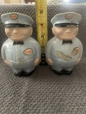 Vtg.  2- 1950s Esso Gas Station Attendant Fat Man Coin Bank, Pa. Some Melt Marks picture
