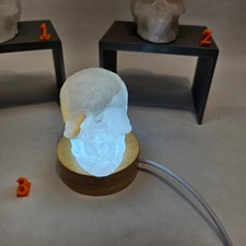 clear quartz crystal white carved skulls with light base deco halloween reiki picture