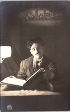 A MAN AND A LARGE OPEN BOOK : ACCOUNTANT? ATTORNEY? : RPPC picture