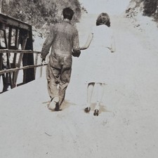 Vintage B&W Photo Snapshot of Couple Holding Hands While Walking Across Bridge picture