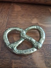 Vintage 1960s Bachman Brass Pretzel Advertising Paperweight HYDE PARK Penn picture