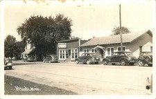 1940s Atlanta Michigan Street Scene autos RPPC Postcard 25-9022 picture
