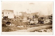 Vintage RPPC Postcard Scrap Yard Junk Shop Wagon Wheels Small Town Americana picture