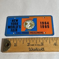 ORIGINAL VINTAGE NEW YORK WORLDS FAIR UNISPHERE BICYCLE LICENSE PLATE 1964-1965 picture
