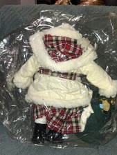 a vintage Santa Claus decorative figurine wearing a cream-colored fleece-trimmed picture
