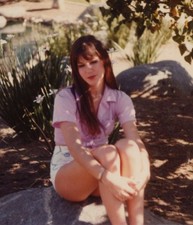 1980s Pretty Woman Pink Crop Top Short Shorts Seated Rock Pond Fashion Portrait picture
