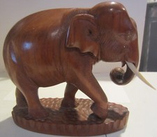 Vintage  hand carved wood elephant with tusks picture