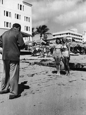 Two women two piece swimsuits pose a photographer sand Miami Beach- Old Photo picture