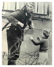 EAST GERMAN SOLDIER HELPS LITTLE BOY SNEAK THROUGH BERLIN WALL 1961 8X10 PHOTO picture