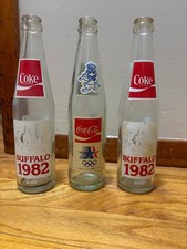 3x Coca-Cola Buffalo 150 years 1832 - 1982  + 1984 Olympics Coke Bottle Lot picture