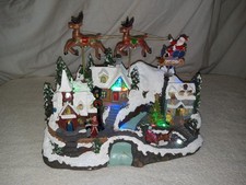 Holiday Time Lighted & Animated Flying Santa Christmas Scene picture