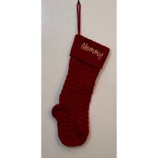 A Red stocking adorned with Mommy in bold, festive letters, perfect Christmas. picture