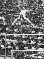 Year-old Russian gymnast Olga Korbut action asymmetric bars Mu- 1972 Old Photo picture