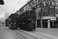 Street scene with street cars passing each other in Hong Kong 1960s Old Photo picture