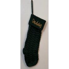 A green stocking adorned with Daddy in bold, festive letters, perfect Christmas. picture