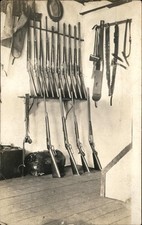 Rifles on rack Great Gun Collection NICE CRISP IMAGE c1910 RPPC Postcard bhn picture