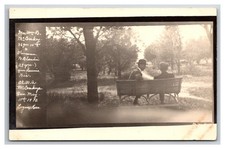 RPPC ~ LOGAN KS ~ Visitors from Wisconsin on Park Bench LOGAN KANSAS picture