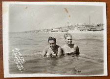Affectionate gentle girls in swimsuits on the beach posing, Vintage photo picture