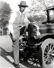 Black Man Standing with Foot on Bumper of Old Car c1930s, Vintage Photo Reprint picture