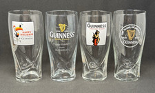 4 GUINNESS 20oz Beer Glasses Embossed Harps Lion Toucan Happy Holidays Draught picture