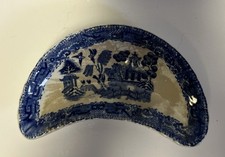vintage ceramic crescent-shaped bone dish featuring the iconic Blue Willow picture