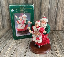 Santa Steals A Kiss & A Cookie Holiday Display On Wooden Base KSA Collectibles picture