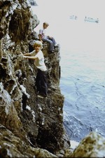 c1970's Kodachrome 35mm Slide, Boy Climbing Rocky Cliff Ocean Water blue picture